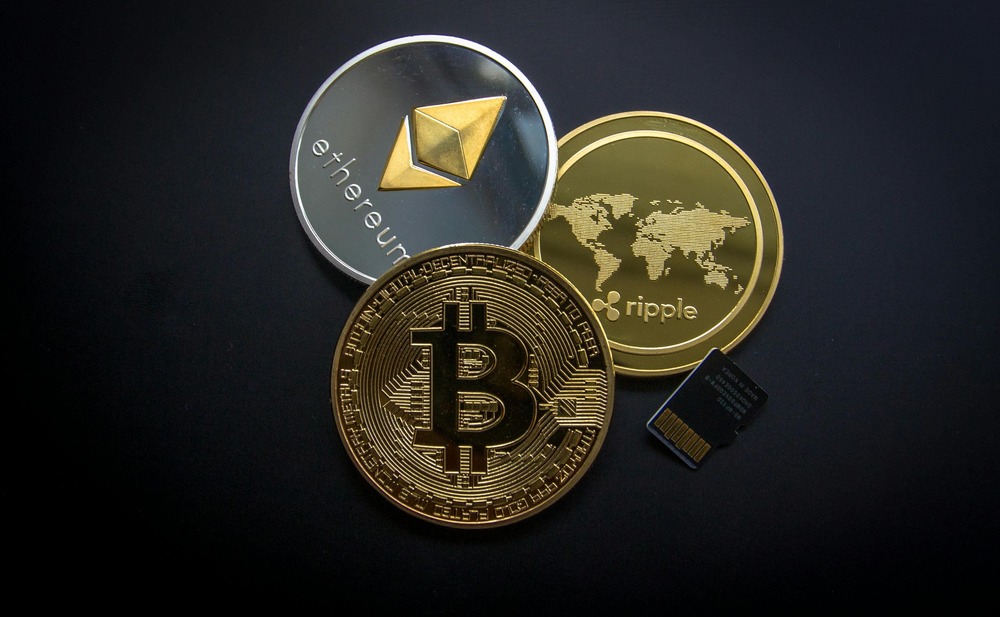 Bitcoin (BTC) cryptocurrency logo and coin displayed on dark background